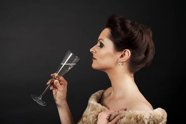 Žena s champagne flétnu — Stock fotografie