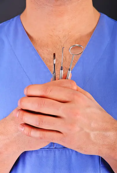 Dentist doctor over dark background — Stock Photo, Image