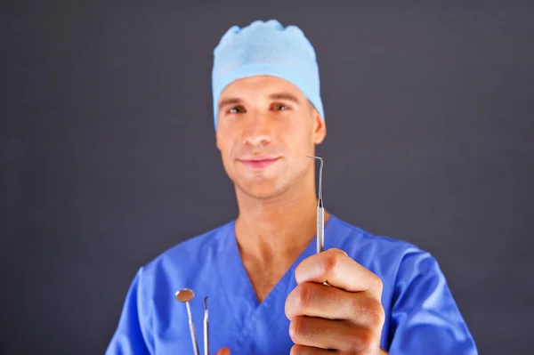 Dentist doctor over dark background — Stock Photo, Image