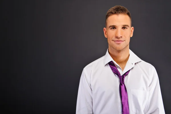 Man with white shirt over dark background — Stock Photo, Image