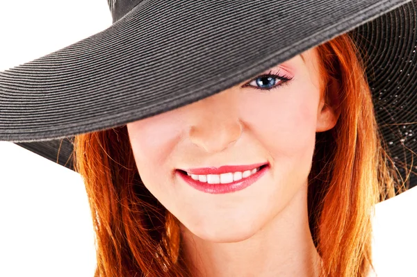 Portrait of beautiful young woman wearing black hat — Stock Photo, Image