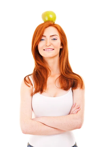 Red hair woman with green apple on her head — Stock Photo, Image