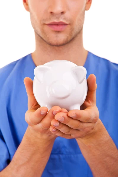 Doctor Holding Piggy Bank Resumen — Foto de Stock