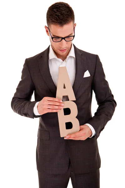 Jovem bonito em terno clássico e com letras abc — Fotografia de Stock