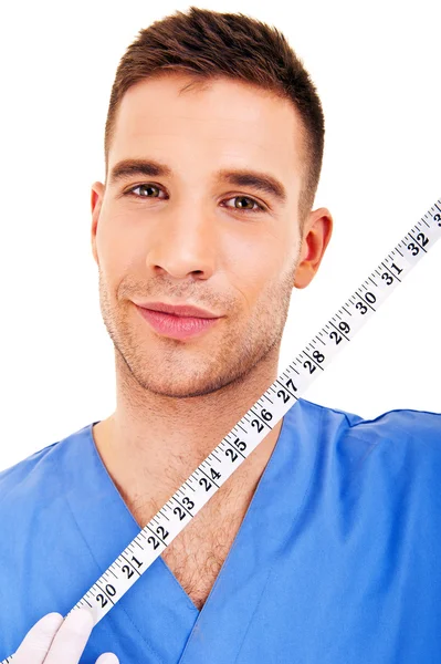 흰색 배경 위에 센티미터와 외과 의사 — 스톡 사진