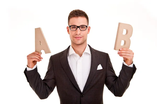 Handsome young man in classic suit and with letters abc — Stock Photo, Image