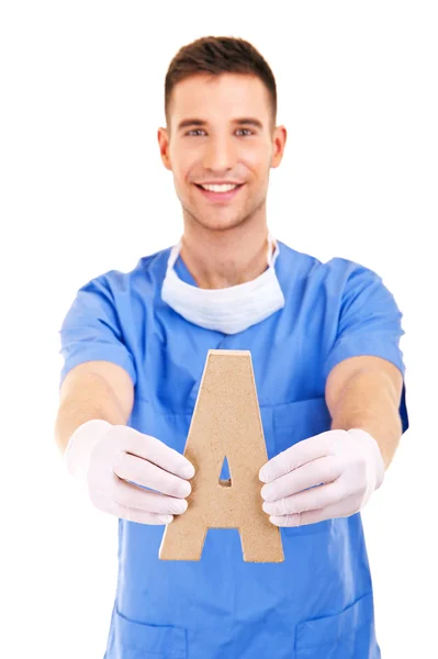 Young doctor holding letter a — Stock Photo, Image