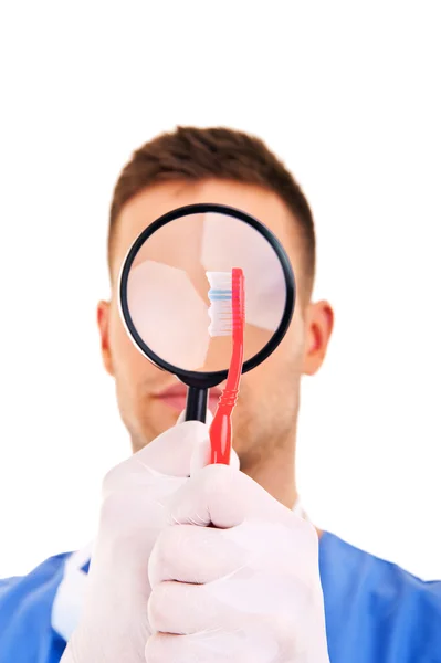 Dentist with toothbrushes — Stock Photo, Image