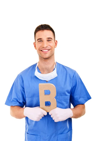 Young doctor holding letter b — Stock Photo, Image