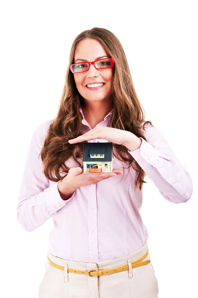 Property insurance concept - woman protect model of the house — Stock Photo, Image