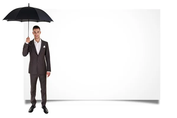 Man holding umbrella and blank board — Stock Photo, Image