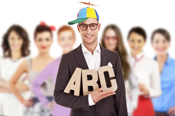 Group of business people with businessman leader in funny hat on — Stock Photo, Image