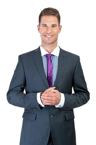 Retrato de un joven hombre de negocios sonriente, aislado en la espalda blanca — Foto de Stock