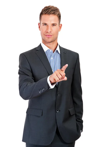 Businessman pressing an imaginary button on bokeh — Stock Photo, Image