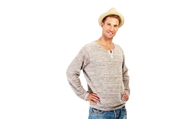 Portrait of a man staring at the camera. He is wearing a hat and — Stock Photo, Image