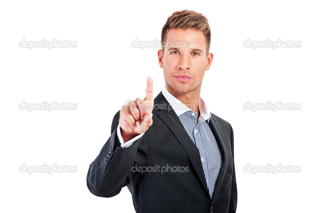 Businessman pressing an imaginary button on bokeh