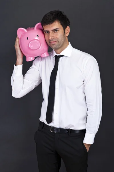 Geschäftsmann mit Sparschwein — Stockfoto