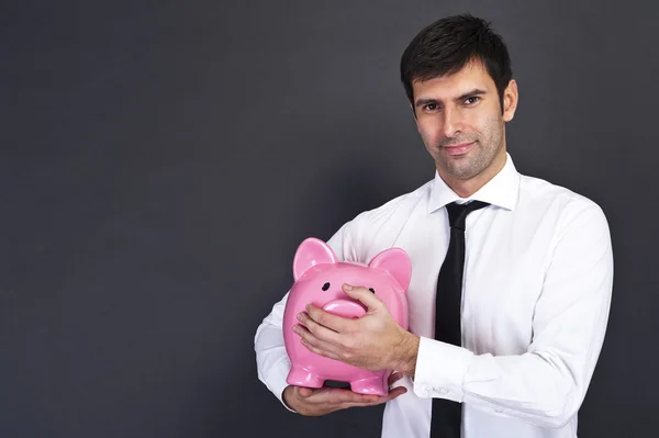 Piggy bank protected by hands — Stock Photo, Image