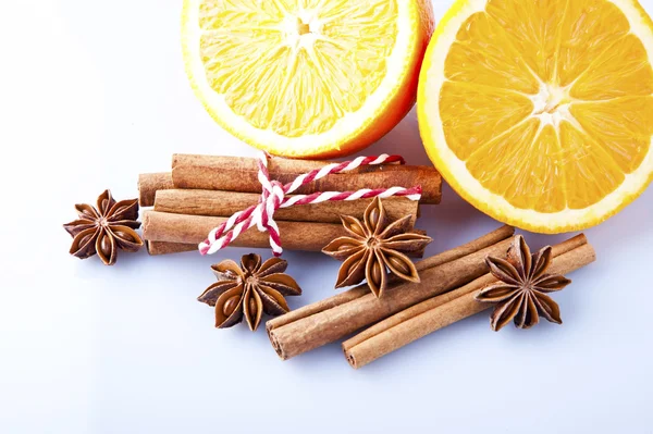Cinnamon sticks, star anise and orange cuts — Stock Photo, Image