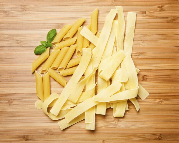 Close up on assortment of uncooked pasta — Stock Photo, Image