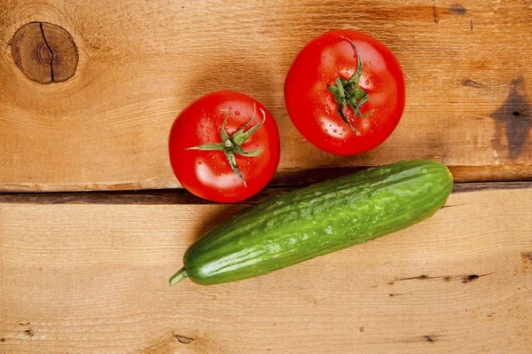 Tomatoes and cucumber — Stock Photo, Image