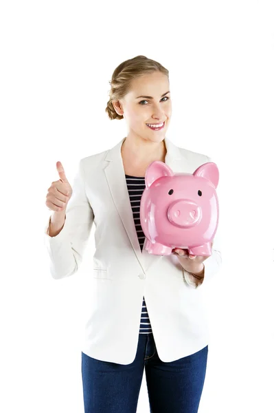 Gelukkig zakenvrouw houden piggy bank tegen witte achtergrond — Stockfoto