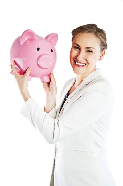Empresária feliz segurando porquinho banco contra fundo branco — Fotografia de Stock