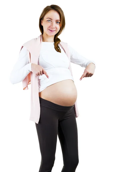 Pregnant woman caressing her belly over white background — Stock Photo, Image