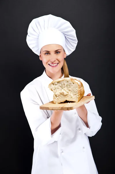 Chef baker smailing, fresh baked bread. — Stock Photo, Image