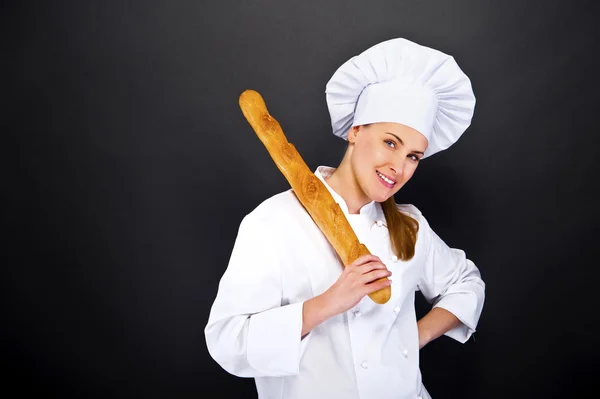 Chef baker smailing, fresh baked bread. — Stock Photo, Image