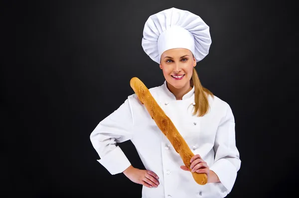 Chef-kok baker lachende, vers gebakken brood. — Stockfoto