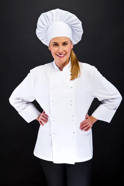Mulher chef sobre fundo escuro — Fotografia de Stock