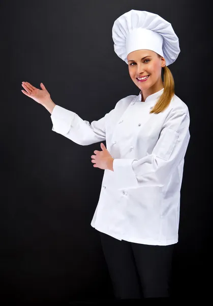 Chef woman showing somthing by hands — Stock Photo, Image