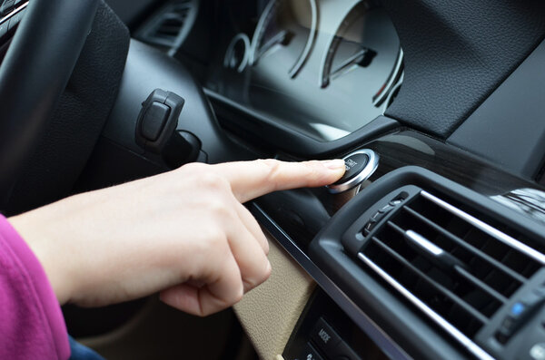 Car driver starting the engine