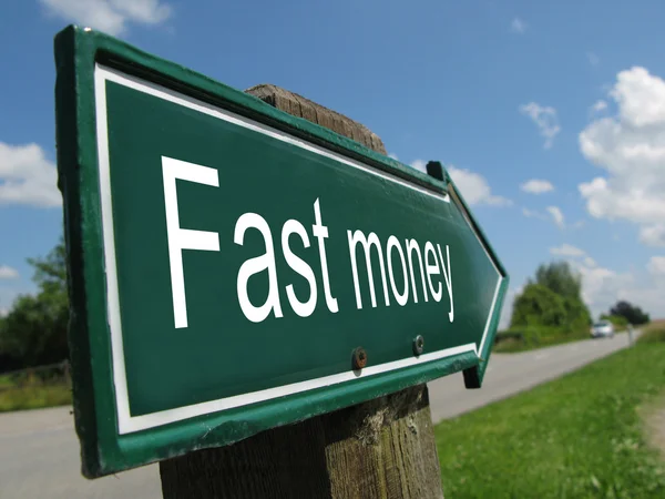 Fast money signpost along a rural road — Stock Photo, Image