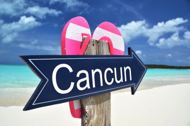 CANCUN sign on the beach clipart
