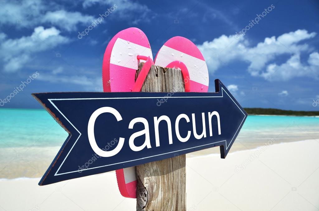 CANCUN sign on the beach