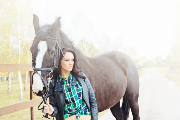 Woman with a horse — Stock Photo, Image