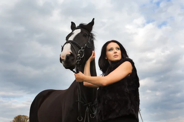 Woman with a horse — Stock Photo, Image