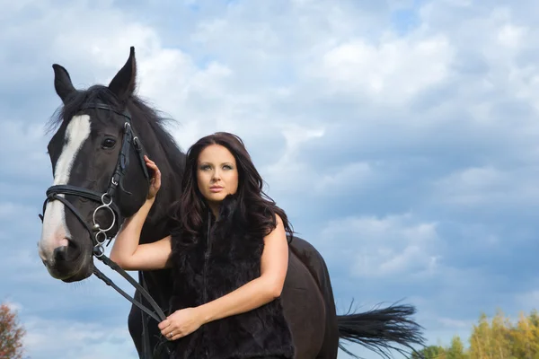 Woman with a horse — Stock Photo, Image