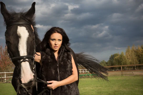 Woman with a horse — Stock Photo, Image