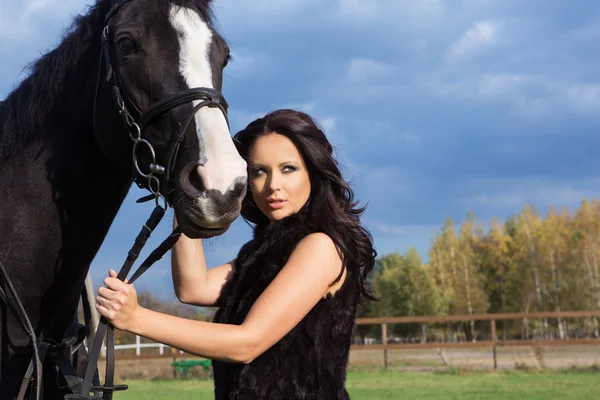 Woman with a horse — Stock Photo, Image