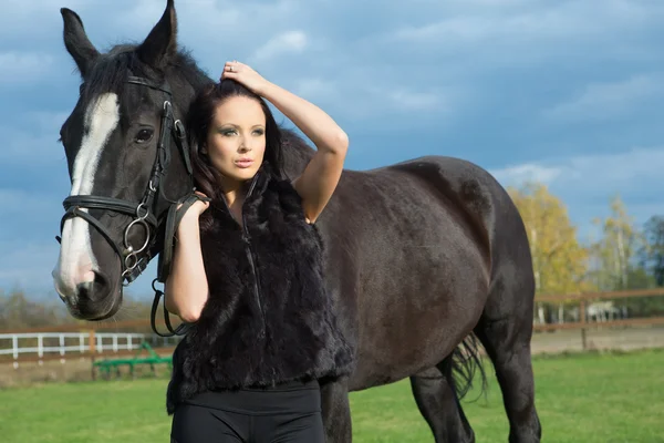 Woman with a horse — Stock Photo, Image