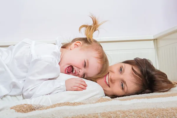 Mother and child having fun at home — Stock Photo, Image