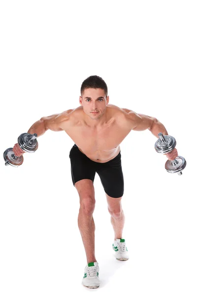 Athletic guy , execute exercise with dumbbells — Stock Photo, Image