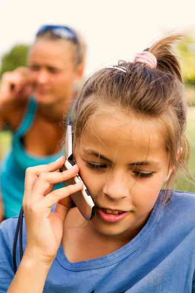 Girls with mobile telephone — Stock Photo, Image