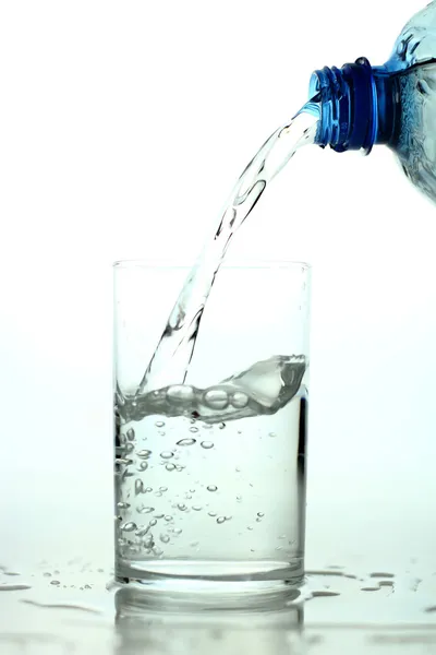 Pouring fresh water on the glass — Stock Photo, Image