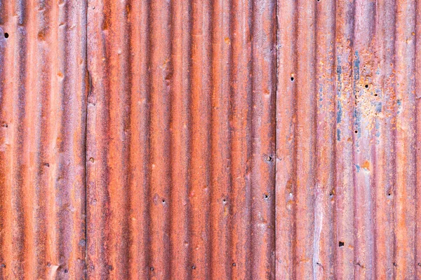 Eski paslı kıvrımlı çelik kaplama arka plan