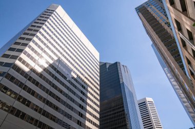 Low angle view of tall skyscraper building in a downtown city