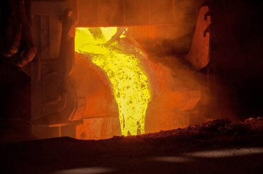 a worker of a metallurgical plant in a foundry